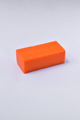 Orange eraser isolated on white background