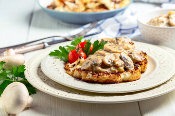 Cauliflower steak with mushrooms.