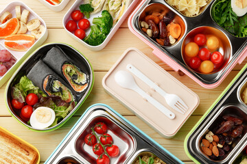 Containers with healthy food on wooden background top view.
