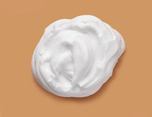 Shaving cream isolated on brown color background	