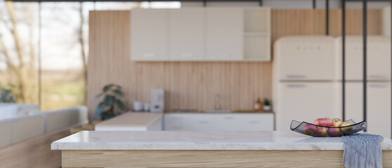 Empty space on white marble kitchen tabletop over blurred modern minimal kitchen in background