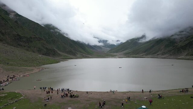 Saif ul Malook Lake and Surrounding Mountains: A Drone's Eye View.  Experience the natural beauty of Pakistan with this drone video of Saif ul Malook Lake and its surrounding mountains. The lake, loca