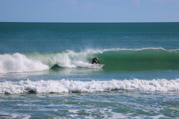 Surfing at Spanish House in Sebastian Inlet state park in Florida