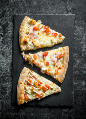 Slices of fragrant pizza with chicken.