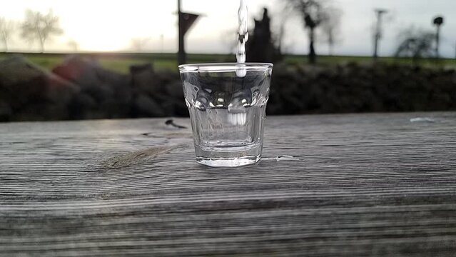 glass with water in slow motion