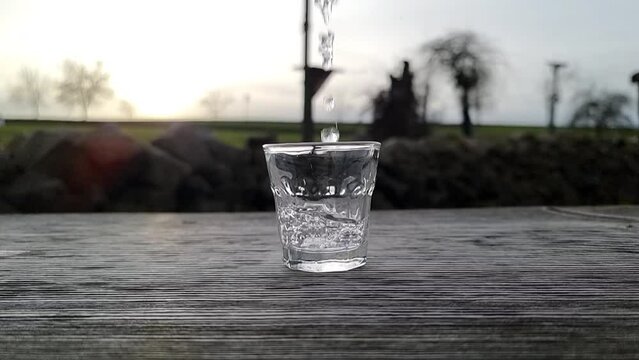 glass with water in slow motion