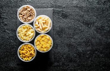 The types of dry pasta in a bowls.