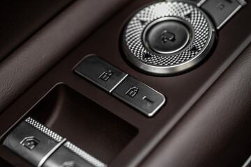 Car central door lock and unlock button close up. Close and open signs.