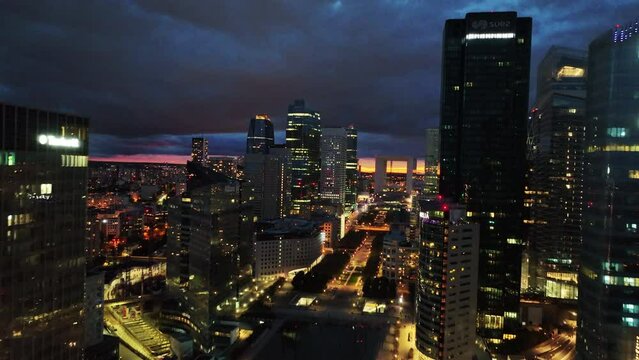 Amazing nighttime aerial of Paris skyline with the city lights