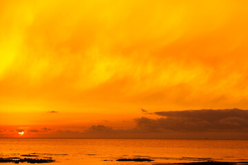 sunset over the sea. a fiery sunset sky.