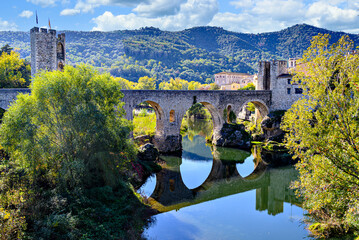 Famous medieval bridge over the river Fluvia in the medieval village de Besalú, Girona, Catalonia,...