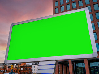 Large Green Screen Advertising Board - City Street scene showing high street and transport hub with...
