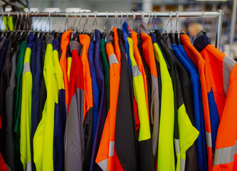 High visibility safety coats and jackets, personal protective equipments, for sale outside, fluorescent colors. 