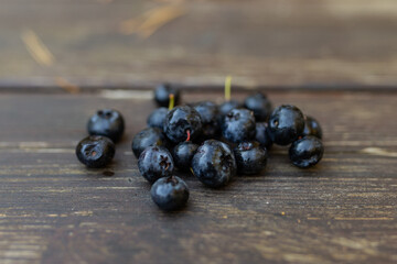 Tasty fresh blueberries on wooden table in autumn