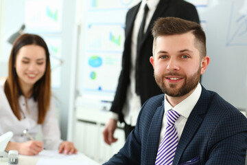 Portrait of handsome young man at business meeting