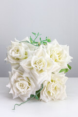 White roses on the table for special occasions to decorate your desk.
