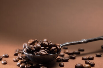 A cup of coffee and coffee beans on the table. . - 562346575