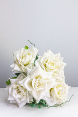 White roses on the table for special occasions to decorate your desk.