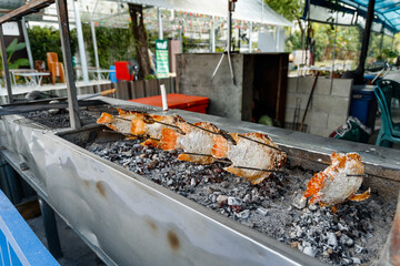 Grilled fish in a street Asian cafe
