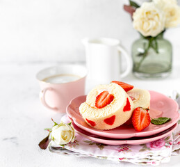Homemade festive Swiss roll with strawberries and cream. Selective focus.