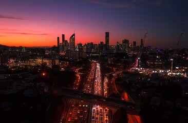 Brisbane Australia at night with traffic and skyline - obrazy, fototapety, plakaty