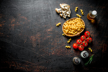 Raw pasta in bowl with mushrooms, spices, oil and cherry.