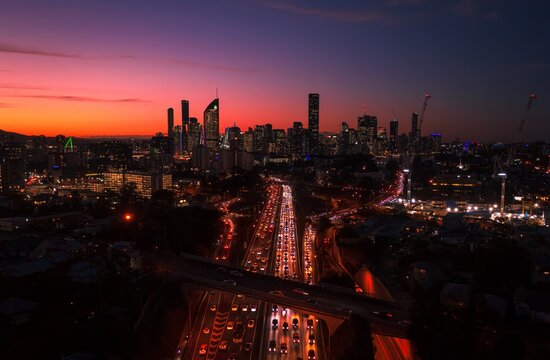 Brisbane Australia at night with traffic and skyline
