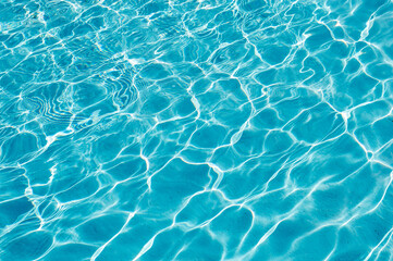 Obraz na płótnie Canvas surface of blue swimming pool,background of water in swimming pool.