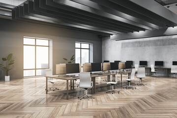 Clean dark concrete and wooden coworking office interior with furniture, equipment, window with city view and sunlight. Workplace and loft space concept. 3D Rendering.