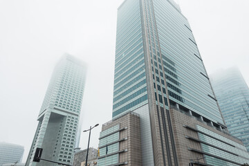 Fototapeta na wymiar Modern city of Warsaw, Poland with office and business buildings in the fog