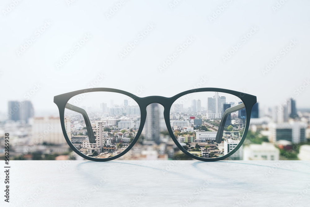 Poster look through glasses at blurred city with mock up place on sky texture. vision and perspective conce