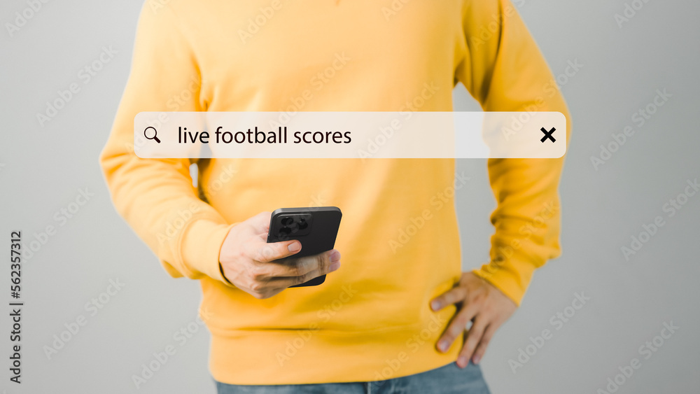 Aufkleber football fan's holding smartphone for search live football scores. searching browsing internet data 