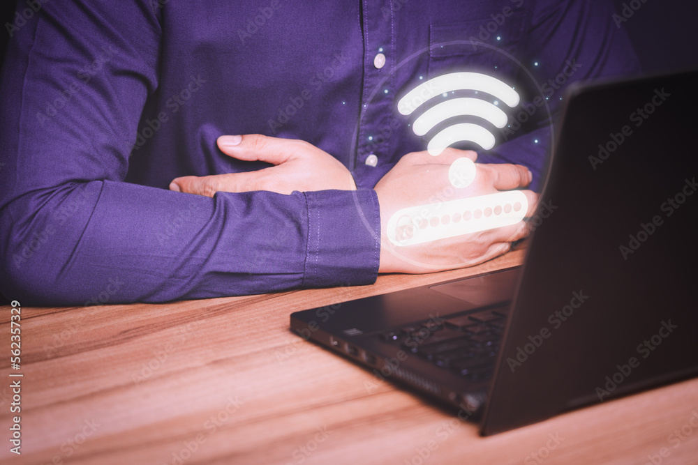 Poster Man using laptop computer to connect to internet wifi and wait for digital information form website to load. Technology concept of waiting to connect to internet Wi-Fi.