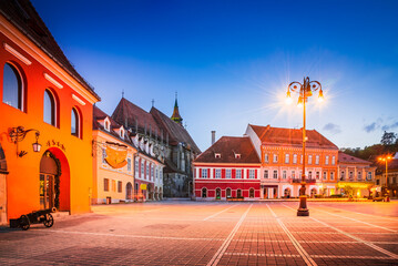 Fototapeta na wymiar Brasov, Romania. Council Square and Black Church, night view beautiful Transylvania travel place.