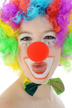 Clown in costume gives an air kiss