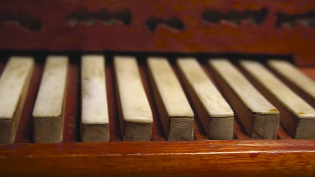Vintage accordion, macro video. The keys of an old accordion. Street Musician Hand Playing Accordionist bayan outdoors Close Up. Ukrainian folk music background wedding day