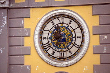 clock on the wall of the church Naples Italy