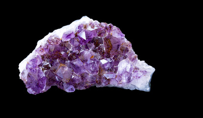 Fototapeta premium Magnificent amethyst on a black background with copy space. Jewelry, gemology, geology.