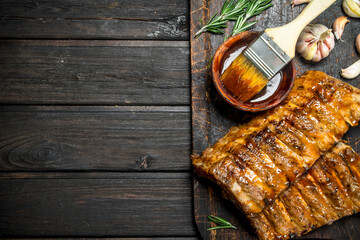 Grilled ribs with sauce, herbs and spices.