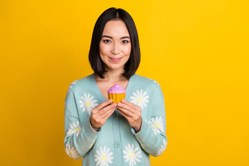 Portrait of optimistic good mood girl with straight hairstyle wear blue cardigan arms hold cake...