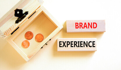 Brand experience symbol. Concept words Brand experience on wooden blocks. Beautiful white table...