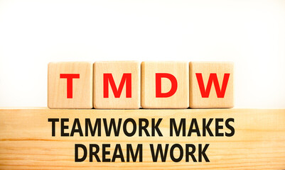 TMDW Teamwork makes dream work symbol. Concept words TMDW Teamwork makes dream work on wooden block on beautiful white background. Business TMWD teamwork makes dream work concept. Copy space.