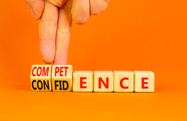 Competence and confidence symbol. Concept word Competence Confidence on wooden cubes. Businessman...