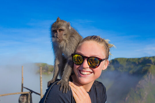 Young woman and monkey