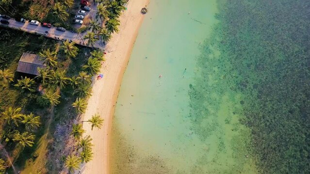 4K Aerial Top View of Nathon Beach, Koh Samui. Beach, sea and sand. Drone view of a beautiful white tropical sand beach on a summer day in Thailand. Top view empty and clean beach. Samui, Thailand
