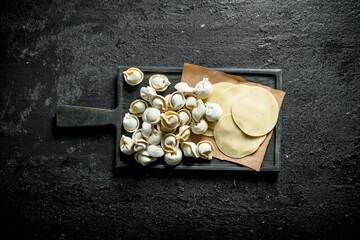 Raw dumpling. Rolled out dough for homemade dumplings.