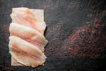 Fish fillet on paper.