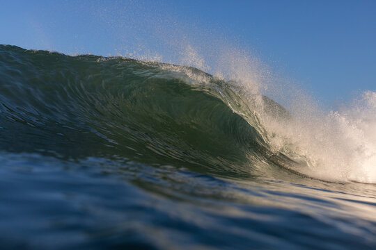 huge waves breaking on the beach