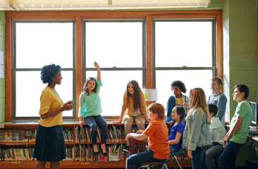 Education, learning and student with questions for teacher in middle school classroom. Library, scholarship group and girl learner raising hand to answer question, studying or help with black woman. - obrazy, fototapety, plakaty