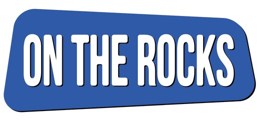 ON THE ROCKS text on blue trapeze stamp sign.